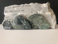 a piece of rock with a poem on it