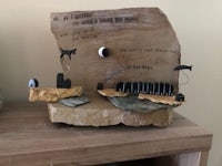 a piece of wood with a poem on it