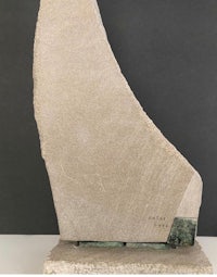 a sculpture of a boat on a pedestal